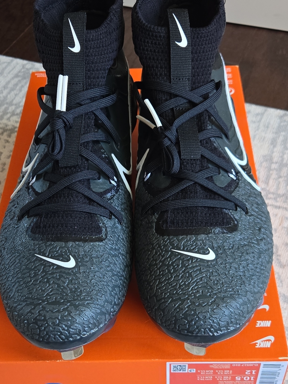 Nike Men's Black Football Cleats with White Swoosh